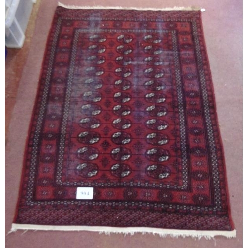 904 - An early to mid Persian Baluch rug on red ground. 188cm x 140cm.
Condition report: Some wear to main... 