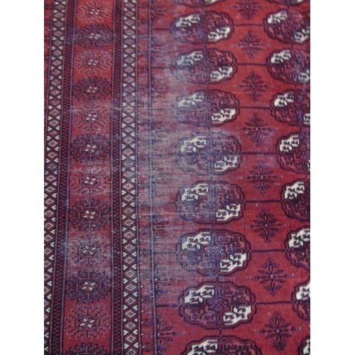 904 - An early to mid Persian Baluch rug on red ground. 188cm x 140cm.
Condition report: Some wear to main... 