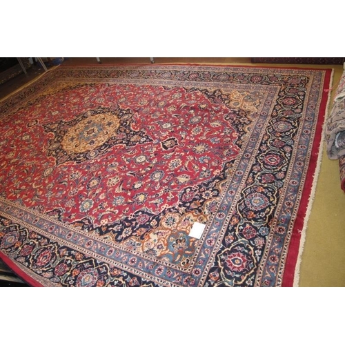 907 - A superb quality meshed carpet central motif on claret ground with blue border. 3.75 x 3.00
Conditio... 