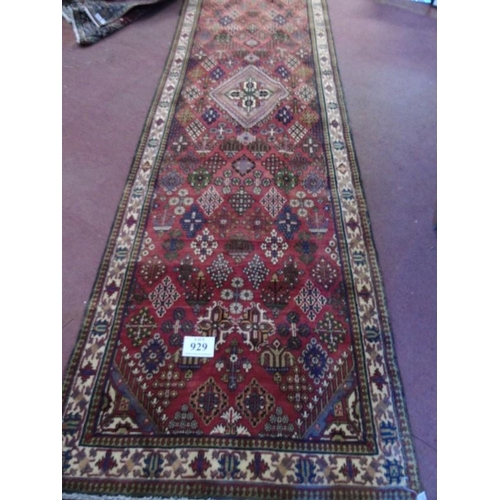 929 - A Persian Melmeh runner on claret ground. 3.90x1.10
Condition report: In very good condition and vib... 