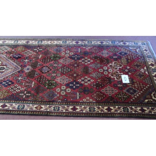 929 - A Persian Melmeh runner on claret ground. 3.90x1.10
Condition report: In very good condition and vib... 