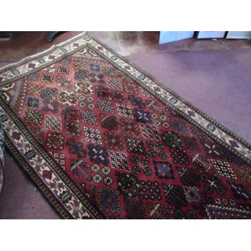 929 - A Persian Melmeh runner on claret ground. 3.90x1.10
Condition report: In very good condition and vib... 