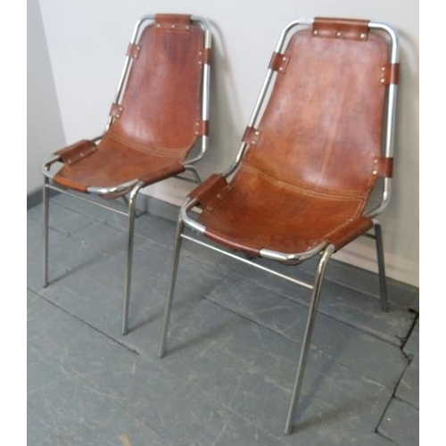 705 - A pair of 1960s ‘Les Arcs’ chairs by Charlotte Perriand, the saddle brown leather hand stitched seat... 