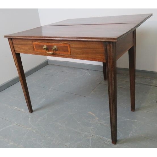 741 - A Georgian mahogany turnover tea table, the inlaid single drawer with brass swan neck handle, on tap... 