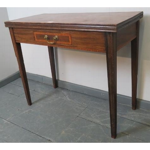 741 - A Georgian mahogany turnover tea table, the inlaid single drawer with brass swan neck handle, on tap... 