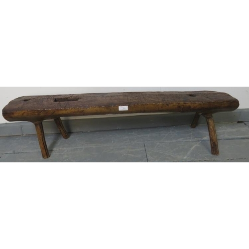 753 - A small antique elm bench seat in rustic naturalistic form. 
Condition report: Various marks consist... 