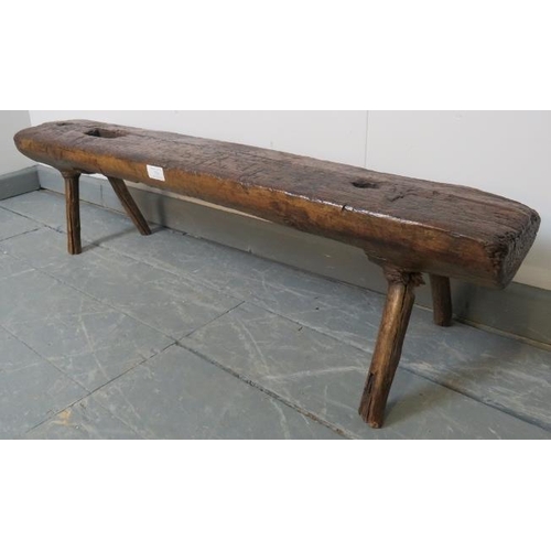 753 - A small antique elm bench seat in rustic naturalistic form. 
Condition report: Various marks consist... 