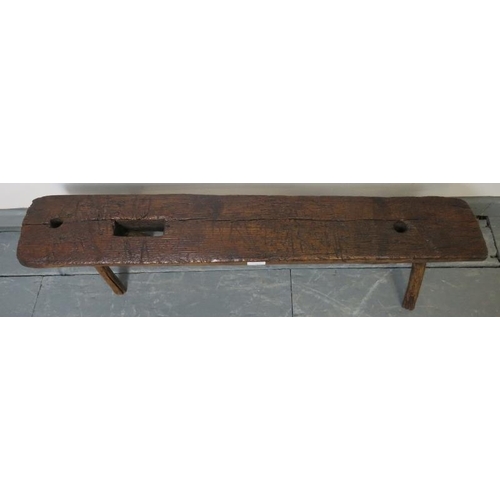753 - A small antique elm bench seat in rustic naturalistic form. 
Condition report: Various marks consist... 