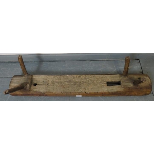 753 - A small antique elm bench seat in rustic naturalistic form. 
Condition report: Various marks consist... 