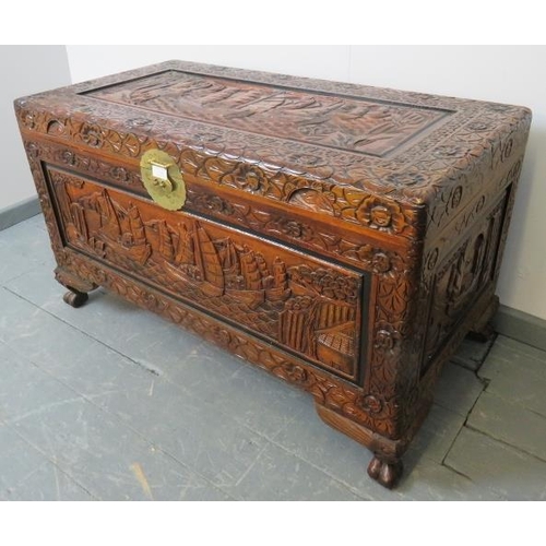 759 - A vintage camphorwood Chinese coffer/blanket box with relief carved panels depicting sailing junks.
... 