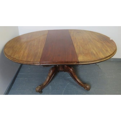 767 - A Victorian walnut circular extending dining table with additional leaf, on a carved and scrolled qu... 