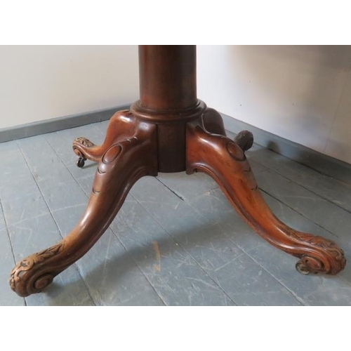 767 - A Victorian walnut circular extending dining table with additional leaf, on a carved and scrolled qu... 