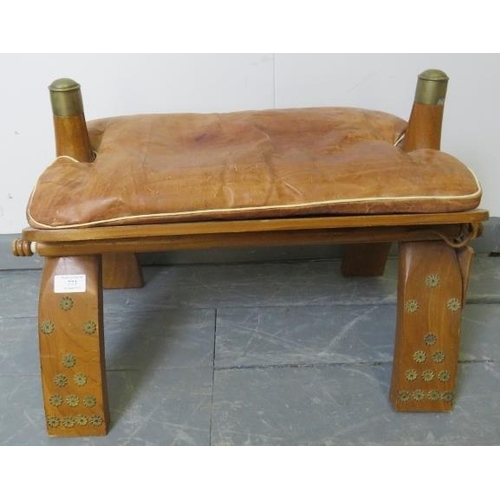773 - A vintage camel stool with loose seat cushion upholstered in tan leather.
Condition report: Minor ma... 