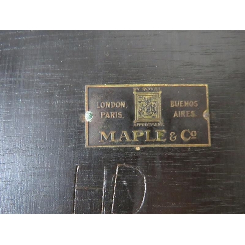 820 - An Edwardian mahogany nest of three oval tables by Maple & Co, with foliate carved borders, on turne... 