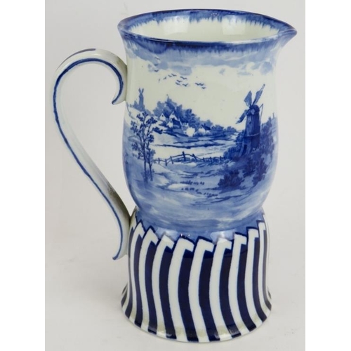 117 - A late 19th century Doulton Burslem flow blue jug with pastoral windmill scene. Height 19cm.
Conditi... 