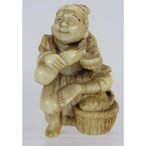 14 - A finely carved Japanese ivory Netsuke, Meiji period of a fisherman sitting on a log.  Height: 4.5cm... 