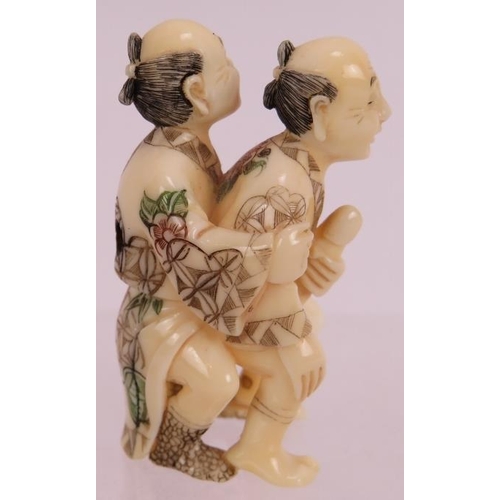 17 - A finely carved erotic Japanese ivory Netsuke, early 20th century, featuring two men and decorated i... 