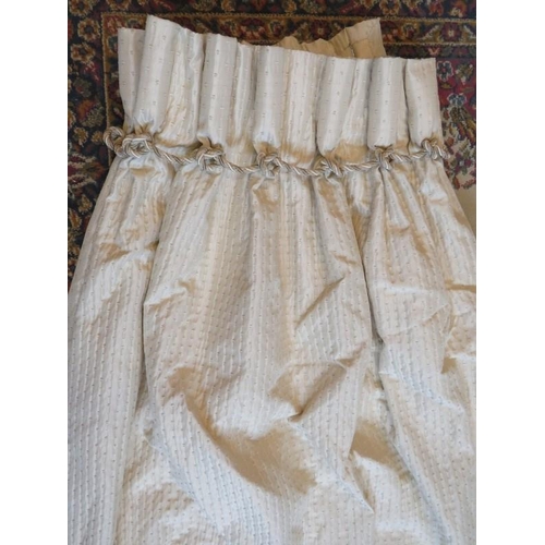 220 - Two pairs of ivory ruched silk curtains with rope twist pleated headers, fully lined. Each curtain d... 