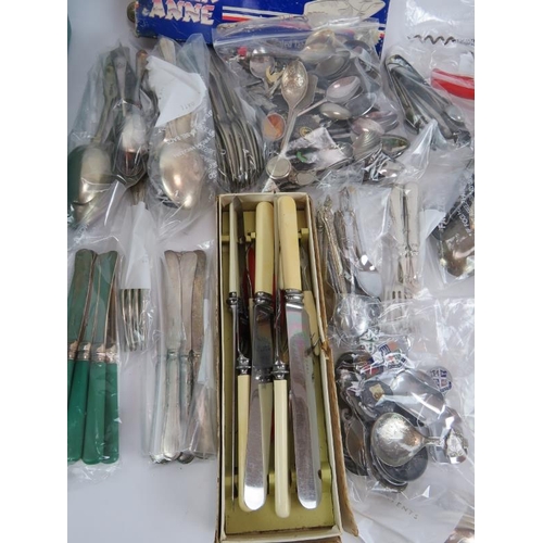 225 - A large selection of silver plated and steel cutlery and accessories including caddy spoons, sugar t... 