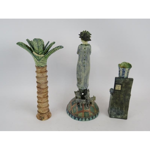 231 - Three pieces of Amanda Popham studio pottery including a pam tree and two figures with cats.  Talles... 