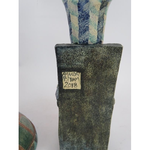 231 - Three pieces of Amanda Popham studio pottery including a pam tree and two figures with cats.  Talles... 