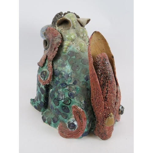 238 - A large studio pottery mythical beast, glazed in blues, greens and browns.  No makers mark.  Height:... 