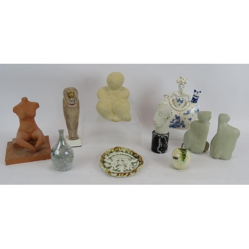 240 - Nine pieces of studio pottery including four abstract figures, a green man pin dish and an Egyptian ... 