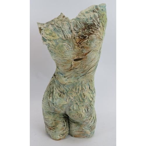 242 - A relief moulded studio pottery female torso by Pauline Lee, Newton Abbot (signed), a pottery wall p... 