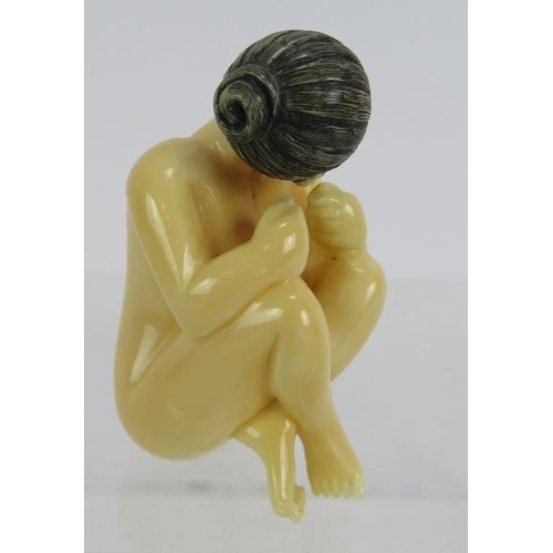 27 - A Japanese erotic carved ivory Netsuke, early 20th century of a female nude. Height: 4.8cm. Signed t... 