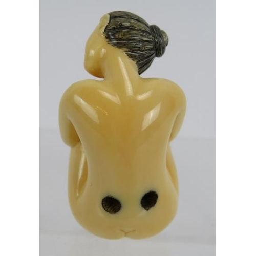 27 - A Japanese erotic carved ivory Netsuke, early 20th century of a female nude. Height: 4.8cm. Signed t... 