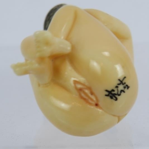 27 - A Japanese erotic carved ivory Netsuke, early 20th century of a female nude. Height: 4.8cm. Signed t... 