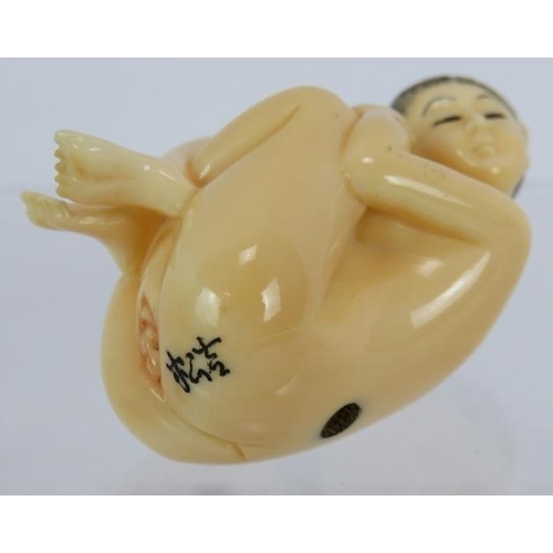 27 - A Japanese erotic carved ivory Netsuke, early 20th century of a female nude. Height: 4.8cm. Signed t... 