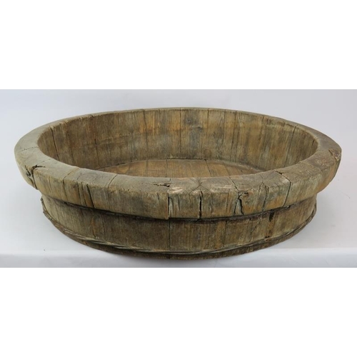 36 - A large coopered oak dairy bowl or dough trough with wire hoops.  Diameter: 68cm.
Condition report: ... 