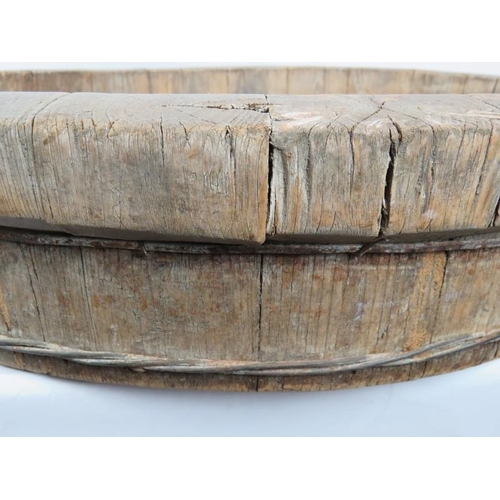 36 - A large coopered oak dairy bowl or dough trough with wire hoops.  Diameter: 68cm.
Condition report: ... 