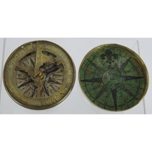 50 - An early 19th century brass pocket folding sundial and compass in screw topped brass case. No maker'... 