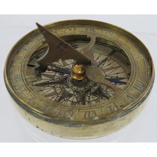 50 - An early 19th century brass pocket folding sundial and compass in screw topped brass case. No maker'... 