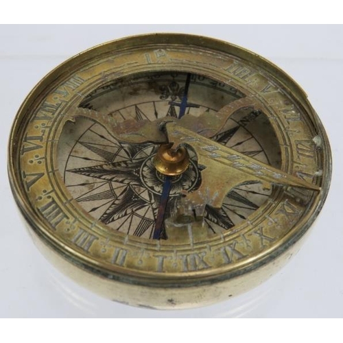 50 - An early 19th century brass pocket folding sundial and compass in screw topped brass case. No maker'... 