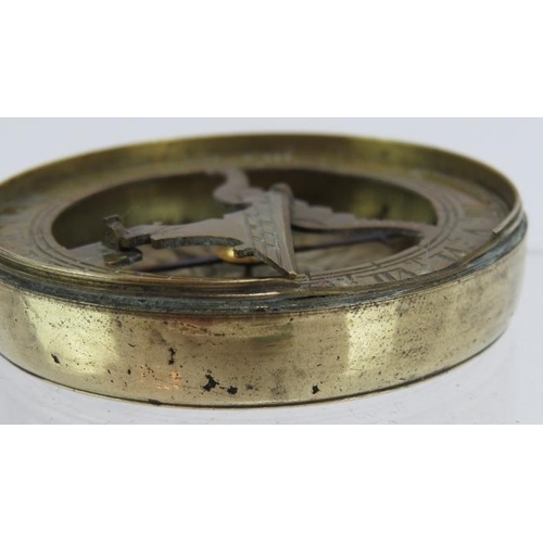 50 - An early 19th century brass pocket folding sundial and compass in screw topped brass case. No maker'... 