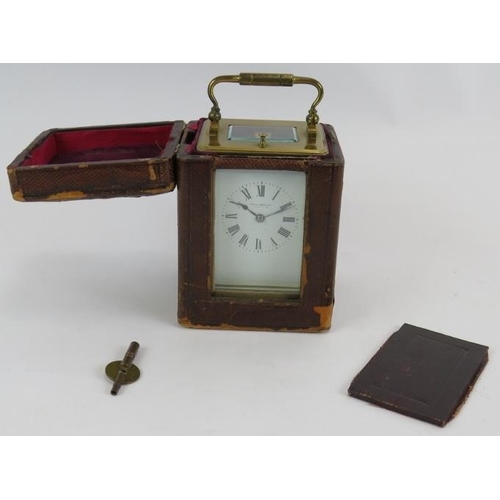 55 - An antique Mappin & Webb Ltd brass repeater carriage clock with leather travel case. Movement No 970... 