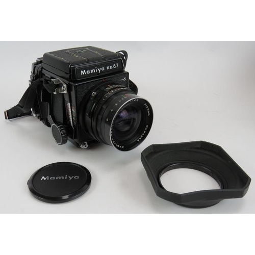 57 - A Mamiya RB67 Pro 5x7 format camera with a 65mm f4.5 Mamiya  Sekor lens. Wooden carrying case and fi... 