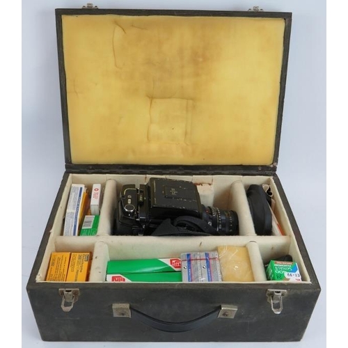 57 - A Mamiya RB67 Pro 5x7 format camera with a 65mm f4.5 Mamiya  Sekor lens. Wooden carrying case and fi... 