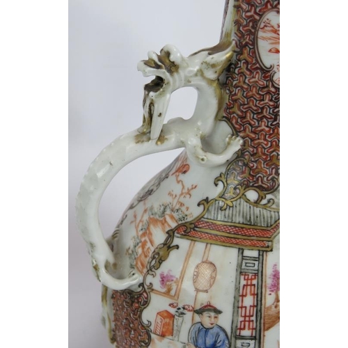 59 - A pair of antique Chinese porcelain ewers with ornate decoration and applied dragon handles. Collect... 