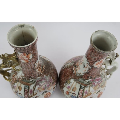 59 - A pair of antique Chinese porcelain ewers with ornate decoration and applied dragon handles. Collect... 