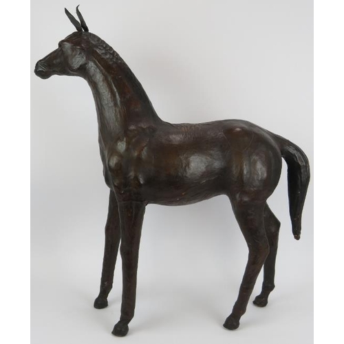 62 - A large vintage leather horse with glass eyes, possibly by Liberty & Co. Height 71cm.
Condition repo... 