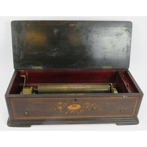 63 - A large 19th century music box in an inlaid mahogany case, probably Swiss. Length 57cm. Depth 24cm. ... 