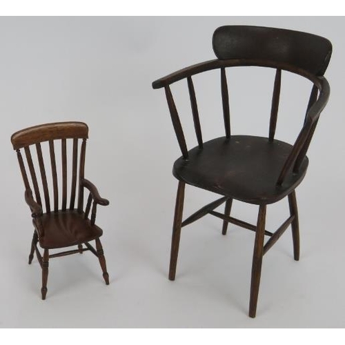 70 - A miniature Georgian style mahogany tilt-top table, a miniature stick back arm chair marked D. Booth... 