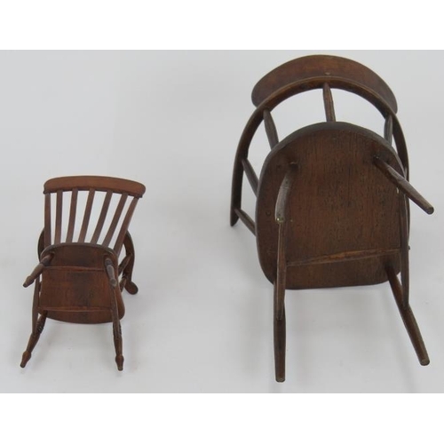 70 - A miniature Georgian style mahogany tilt-top table, a miniature stick back arm chair marked D. Booth... 