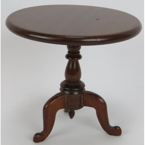 70 - A miniature Georgian style mahogany tilt-top table, a miniature stick back arm chair marked D. Booth... 