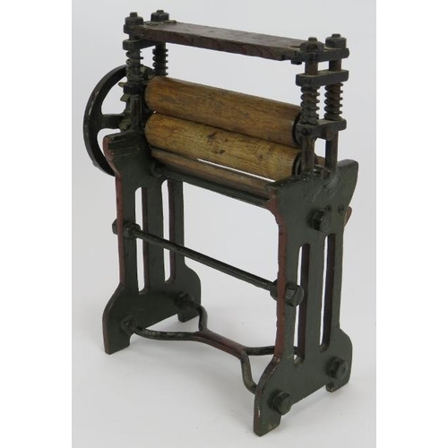 72 - A miniature laundry mangle constructed from steel, brass and wood, fully working. Height 26cm.
Condi... 