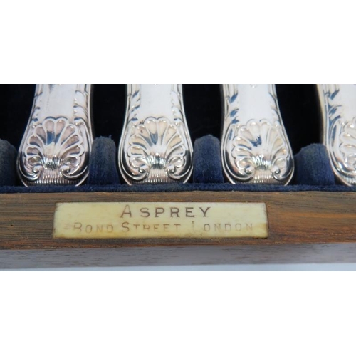 74 - A boxed set of Asprey & Co fish knives and forks, a pair of similar fish servers, a pair of salad se... 